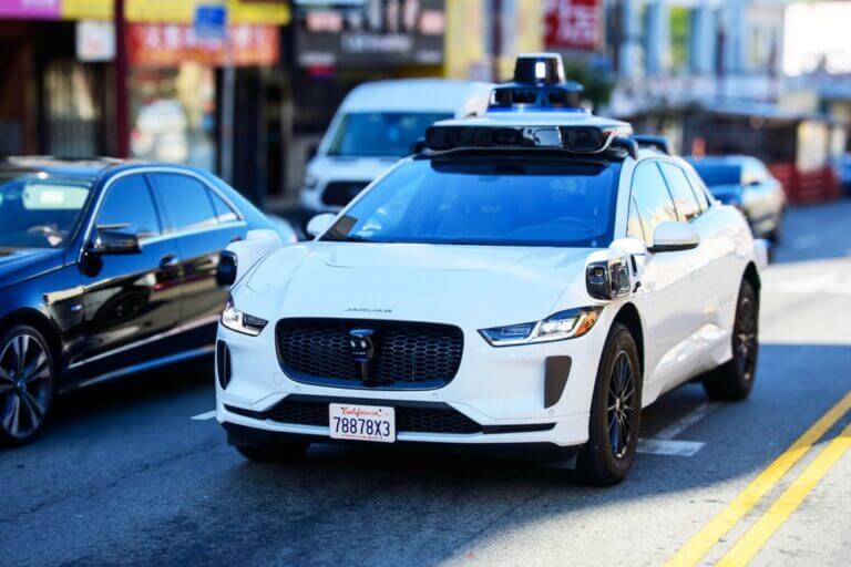 Waymo,One,Jaguar,Driverless,Car,On,Urban,Street.,Front,Side